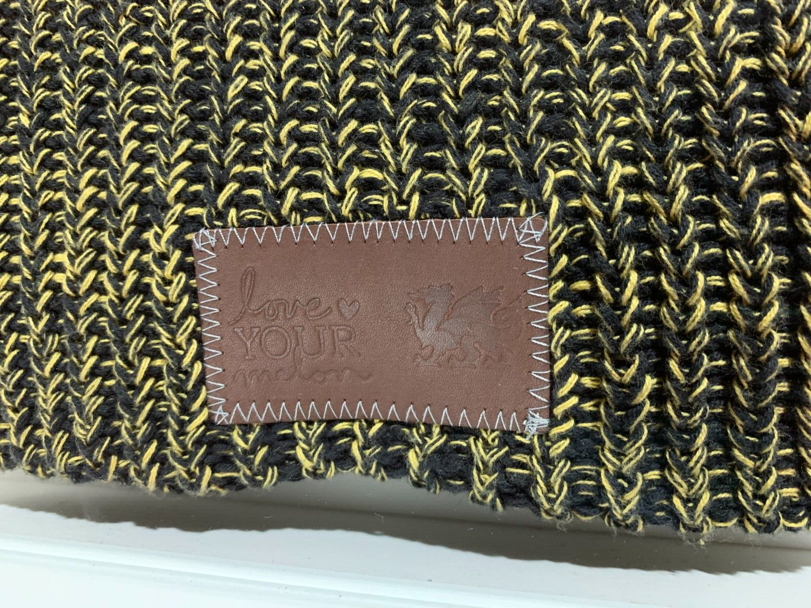 FRAMED Love Your Melon x Cambria Knit Beanie Black & Yellow Leather Patch